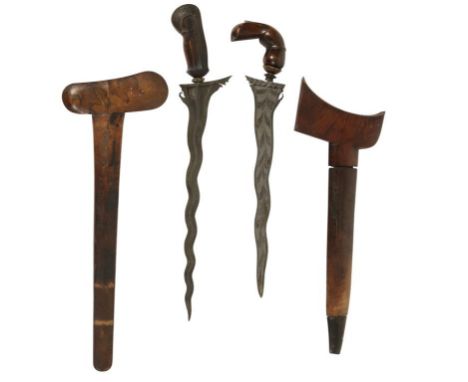 A MALAYSIAN KRIS DAGGER with carved walnut handle and mahogany scabbard and one other Kris dagger (2)
