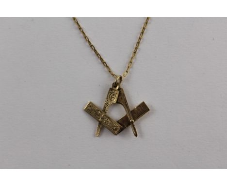 A 9ct gold Masonic square and compass pendant, on gold chain marked '375' to the clasp, approx 5.5g.