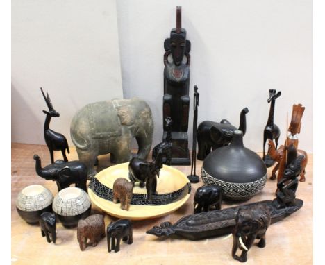 A collection of African tribal art, tourist art and pottery to include a soapstone dish, a ceramic gourd vase, a pottery elep