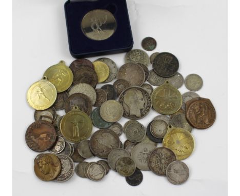 A collection of coins and medals to include an Italian Fascist 15th Infantry regiment 'Treviso' medal of the Marmarica Infant
