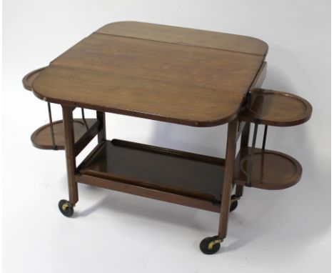An Edwardian/mid-20th century tea trolley with drop-down sides and double cake stand to either side with lower shelf and tray
