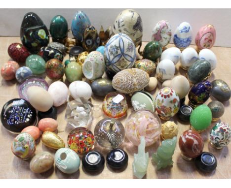 Eight paperweights to include a Mdina example and a large quantity of decorative eggs to include papier mâché, jeweled, Wedgw