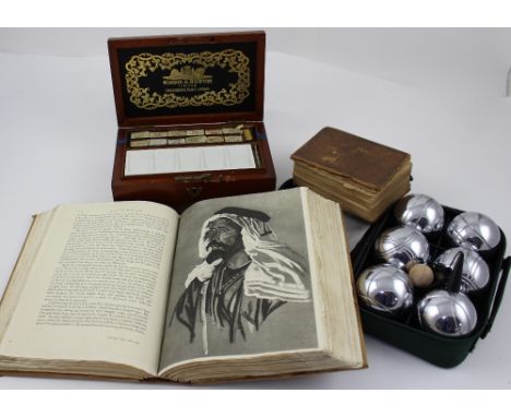 A cased set of six boules, an early 20th century Windsor and Newton Ltd London mahogany artist's box containing a ceramic pal