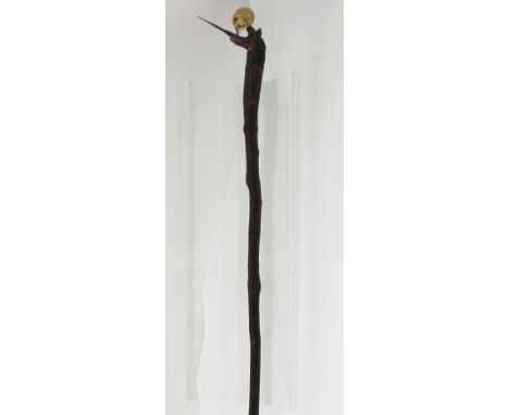 A 19th century hawthorn walking stick with Meiji period Japanese ivory skull okimono mounted to the handle and later applied 