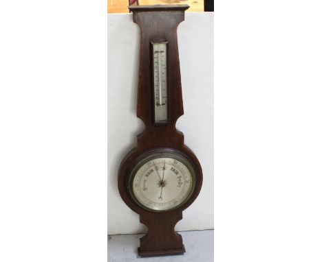 An early 20th century mahogany aneroid barometer/thermometer with satinwood cross-banding, height 86.5cm. CONDITION REPORT Pl