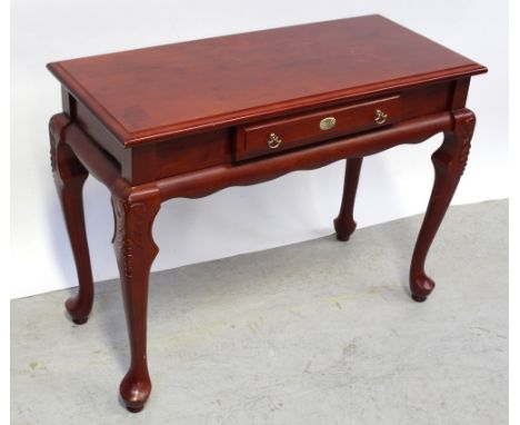 A modern mahogany single-drawer console table on cabriole legs to pad feet, width 90cm.