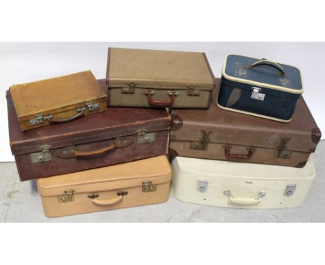 A collection of vintage suitcases, various sizes and colours (7).