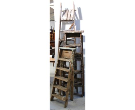 Three sets of vintage wooden ladders of graduated size, largest height 221cm (3).