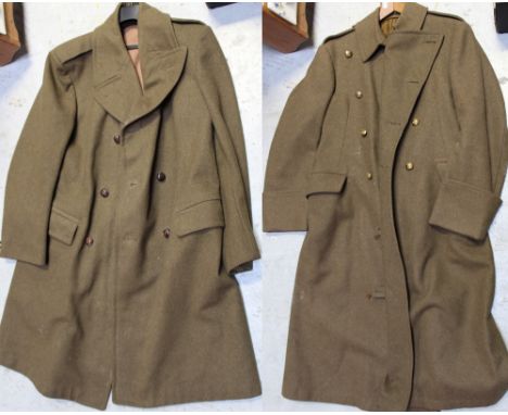 Two mid-20th century green army great coats, one with leather toggle buttons, the other with brass military buttons (2).