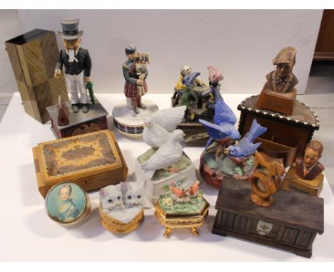 A quantity of vintage and contemporary music boxes to include musical figures, birds, music boxes, replica figural money boxe