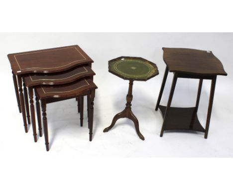 A contemporary nest of three bow-front tables on turned tapering legs, an Art Deco style side table with square tapering legs