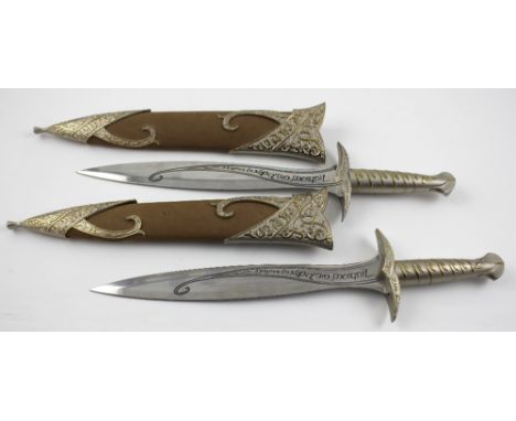 Lord of the Rings imitation props; a pair of swords as carried in the Lord of the Rings films by Frodo, with moulded metal ha