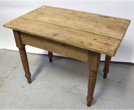 A vintage scrubbed pine kitchen table, 66 x 104.5cm.