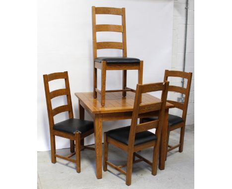 A modern square oak draw-leaf table with Nathan leaf, 19 x 19cm and four modern oak ladder-back dining chairs (5). CONDITION 