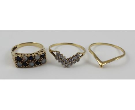 A small group of 9ct gold ladies' dress rings to include a 9ct gold wishbone ring, size V 1/2, a similar paste-set example, s