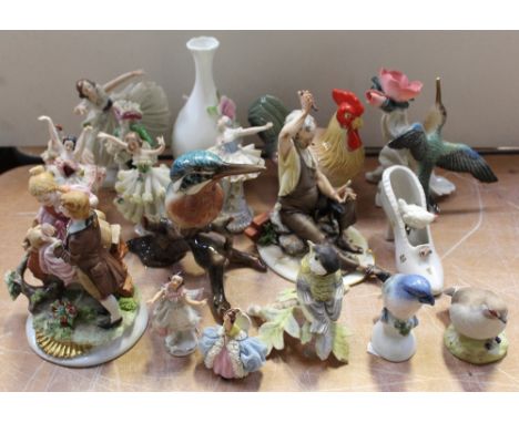 Eight Dresden and Dresden-style lace figures in various poses, a Dresden ornamental shoe, a Capodimonte figure of a shoemaker