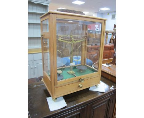 Laboratory Scales, in glazed display case, 42cm wide some weights to single drawer.