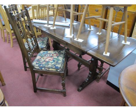 Ercol Dark Wood Draw Leaf Dining Table and Four Spindle Back Chairs.