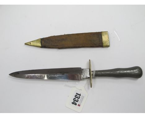 A Dagger in the Commando Style, with metal handle, brass cross guard, in brown leather and brass sheath, 27cm long unnamed.