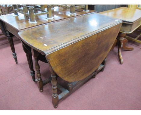 Titmarsh Goodwin Style Oak Gate Leg Table, with drop leaves on turned and block supports.