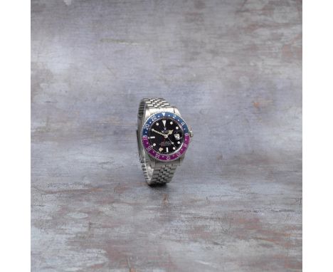 Rolex. A stainless steel automatic calendar bracelet watch with dual time zoneModel: GMT Master 'Fuchsia'Reference: 1675Date: