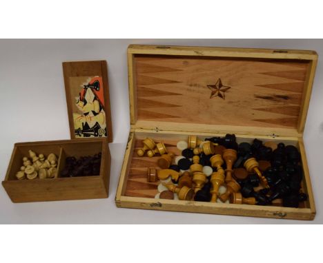 Wooden box containing a wooden chess set and counters, marked for backgammon and chess