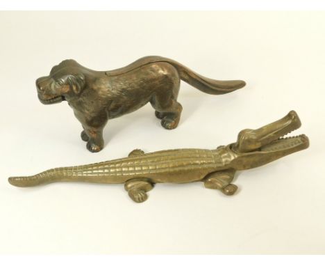 NUT CRACKERS. A copper anodised dog nutcracker &amp; a brass alligator nut cracker. Alligator 36cm.