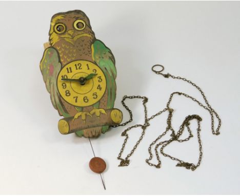 NOVELTY CLOCK. A Paico novelty wall clock, the wooden front painted as an owl, with moving eyes.