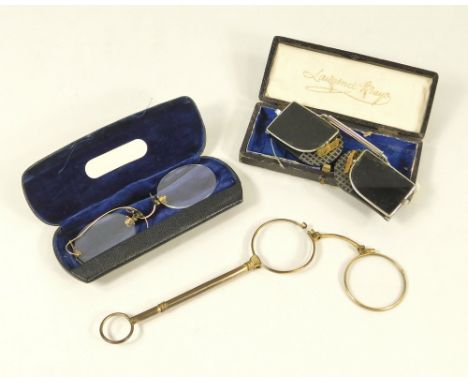 SPECTACLES.A pair of gilt metal lorgnette, a pair of rimless spectacles with chain & a pair of Lawrence & Mayo 'Amulet' anti-