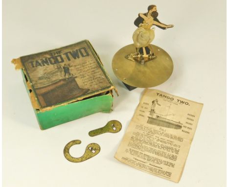 THE TANGO TWO. A 1920's Tango Two toy. For use on a table-top gramophone, with original cardboard cut out, metal table, tin s