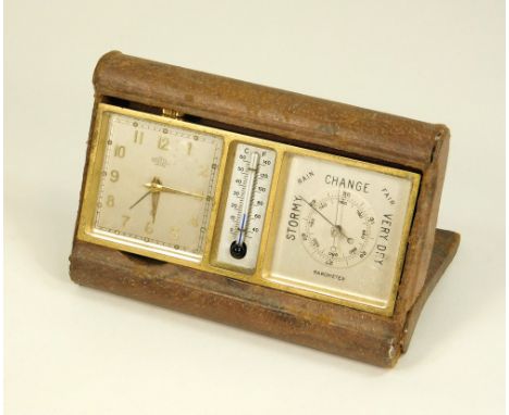 DESK CLOCK. A 1940's/50's Angelus, eight day clock with alarm & incorporating a thermometer & a barometer. In leather covered