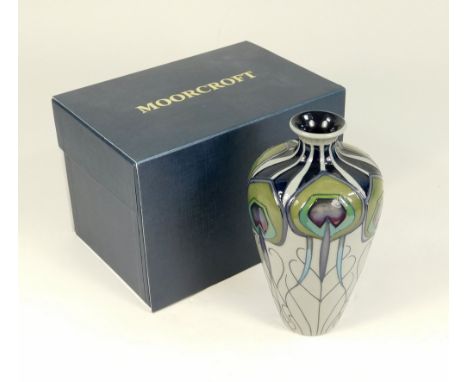 MOORCROFT. A Moorcroft vase in the Peacock Parade pattern. The base with various stamped &amp; painted marks &amp; original r