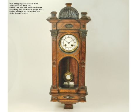 WALL CLOCK. A late 19th century walnut veneered wall clock. Height 62cm.