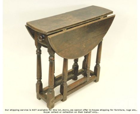 GATE LEG TABLE. A small oak gate leg table, fitted a single drawer. H64 x D73cm.