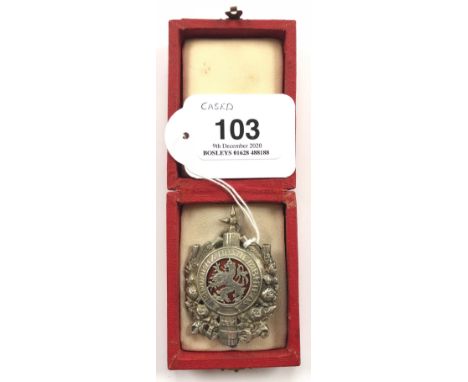 Bulgaria Justice cased breast badgeGood silvered disc with motto superimposed on bundle of Rods and Axe resting in floral spr