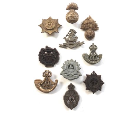 10 WW2 plastic economy cap badges.Cheshire (one blade) ... Royal Northumberland Fusiliers ... Royal Fusiliers ... Essex ... W