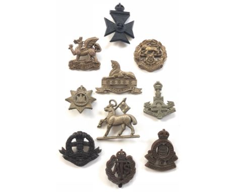 10 WW2 plastic economy cap badges.Buffs ... King’s Royal Rifle Corps ... Hampshire ... Devonshire ... Lincolnshire (blades re