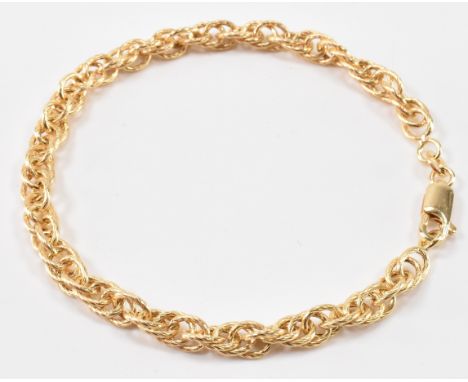 A gold chain bracelet having spiral incised chain links and lobster clasp. Marked 375 to clasp. Measures 19cm length. Weight 