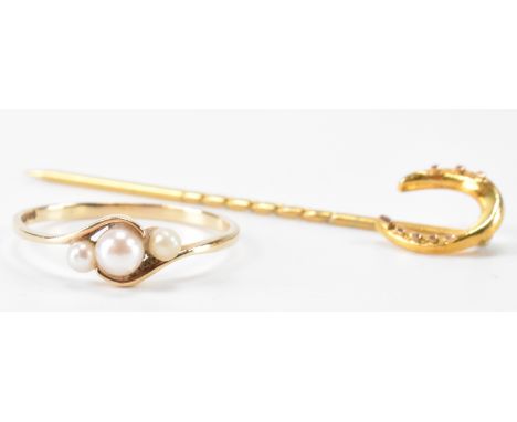A hallmarked 9ct gold and pearl crossover ring together with a 9ct gold finial stick pin. Ring hallmarked Birmingham 1987, st
