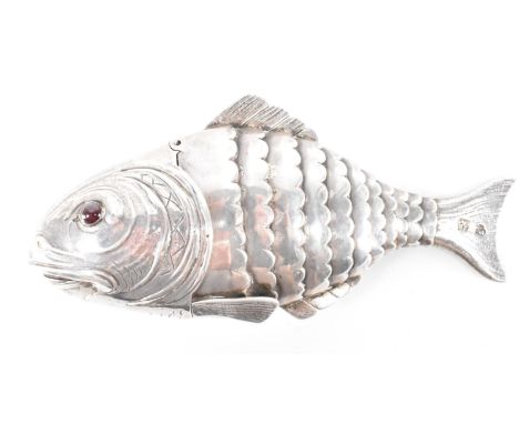 An early 20th Century Edwardian silver hallmarked articulated snuff / spice fish box. The fish having red stone eyes with an 