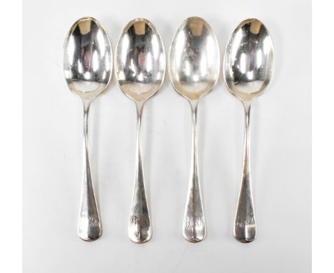 A set of four Edwardian silver hallmarked rat tail spoons. The spoons hallmarked Birmingham 1906. Makers marks for&nbsp;T Wil