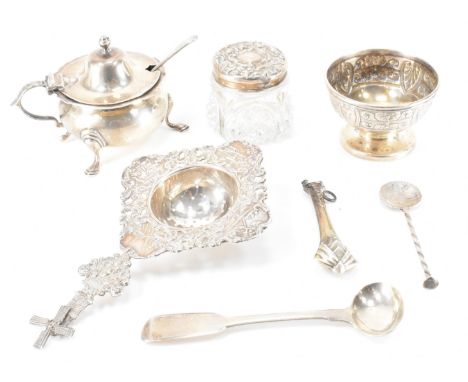 A collection of hallmarked silver tableware items to include an Edwardian condiment pot with blue glass liner. Assay marked f