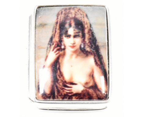 A silver and enamelled pill pot having Boudica portrait atop lid. Marked sterling to interior. Measures 30mm x 11mm x 22mm. T