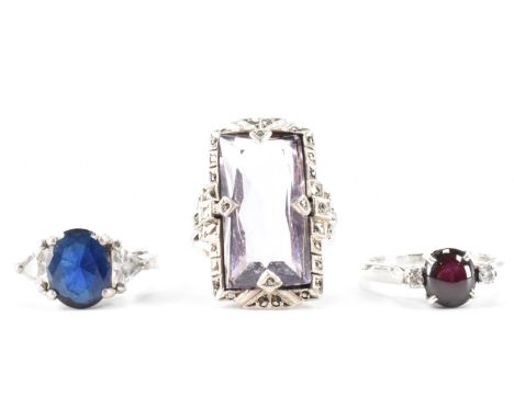 A group of three vintage stone set rings. The lot to include an Art Deco style amethyst and marcasite dress ring (shank tests