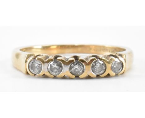 A hallmarked 9ct gold and diamond five stone ring. The ring being set with five brilliant cut diamonds to a plain band. Hallm