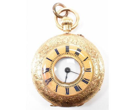 An 18ct gold half hunter fob pocket watch. The watch having an engraved case with window to the centre with a halo of blue en