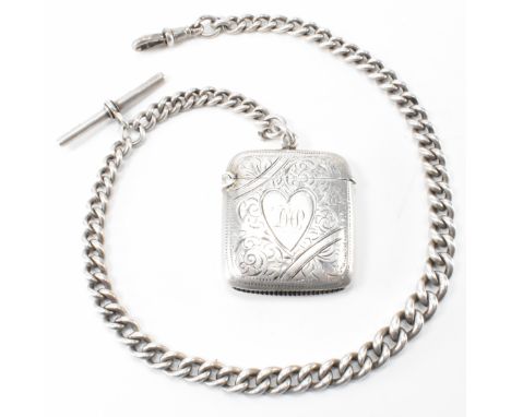 A hallmarked silver vesta case and pocket watch chain. The vesta of square form having an engraved heart to the centre with f