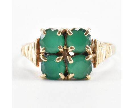 A hallmarked 9ct gold and chrysoprase four stone ring. The ring having incised shoulders and four round cut chrysoprase to th