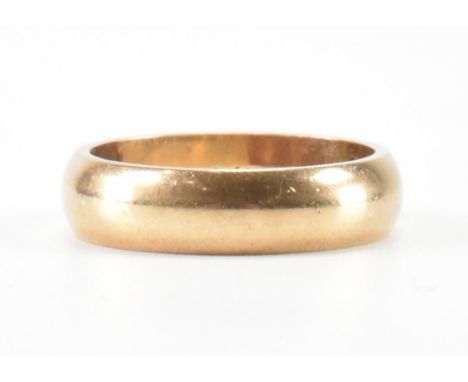 A hallmarked 9ct gold wedding band ring. The ring having personalised inscription to inside of the band. Hallmarked under Lon