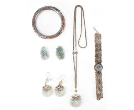 A selection of white metal and jade Chinese jewellery. The lot to include a wirework and jade bracelet, a pair of jade rounde